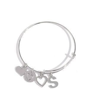 One size fits all ! Silver bracelet with initials S. With other charms .